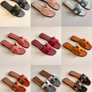 Authentic Hermès Oran croc-embossed leather sandals featuring the iconic H cutout strap with a luxurious exotic texture.